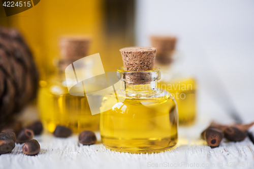 Image of The cedar oil in a glass bottle