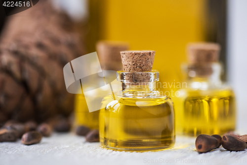Image of The cedar oil in a glass bottle