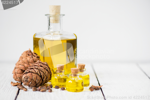 Image of The cedar oil in a glass bottle