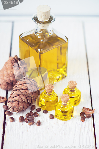 Image of The cedar oil in a glass bottle