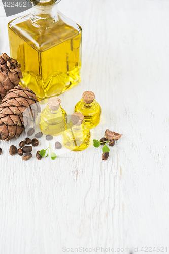 Image of The cedar oil in a glass bottle