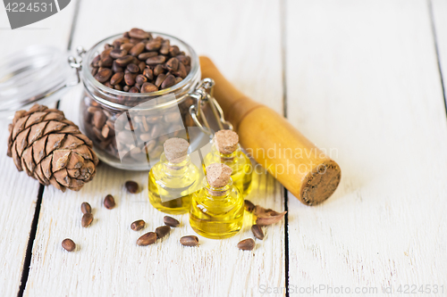 Image of The cedar oil in a glass bottle