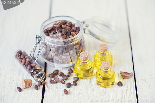 Image of The cedar oil in a glass bottle