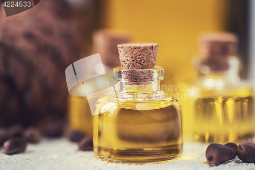 Image of The cedar oil in a glass bottle