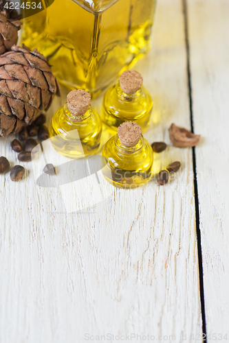 Image of The cedar oil in a glass bottle