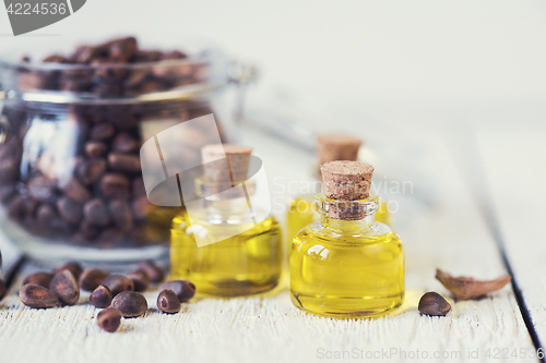 Image of The cedar oil in a glass bottle