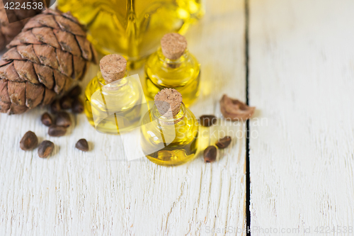 Image of The cedar oil in a glass bottle