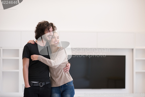 Image of couple hugging in their new home