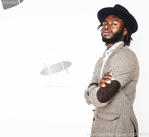 Image of young handsome afro american boy in stylish hipster hat gesturin