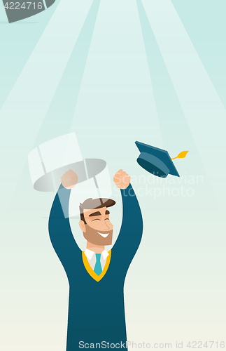 Image of Graduate throwing up graduation hat.