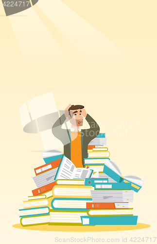 Image of Student sitting in huge pile of books.