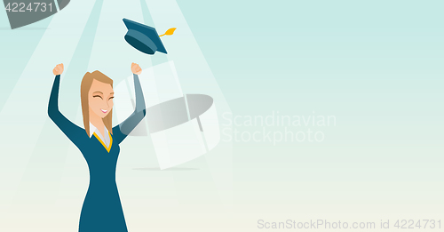 Image of Graduate throwing up graduation hat.