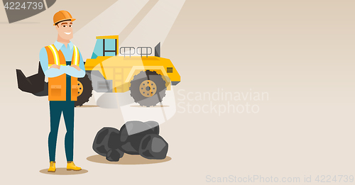 Image of Miner with a big excavator on background.