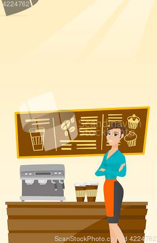 Image of Barista standing near coffee machine.