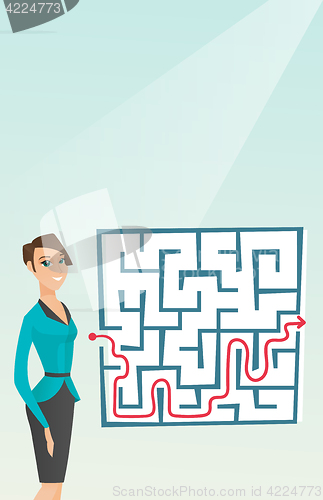 Image of Business woman looking at labyrinth with solution