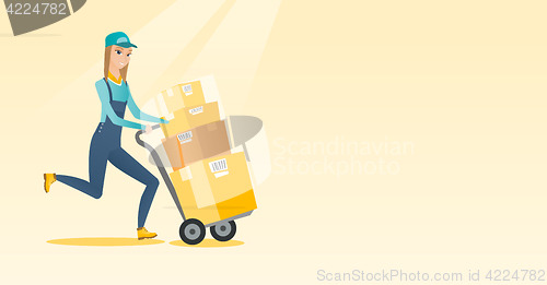 Image of Delivery postman with cardboard boxes on trolley.