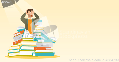 Image of Student sitting in huge pile of books.