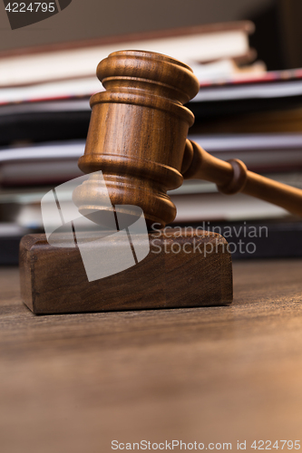 Image of Photography of hammer against documents