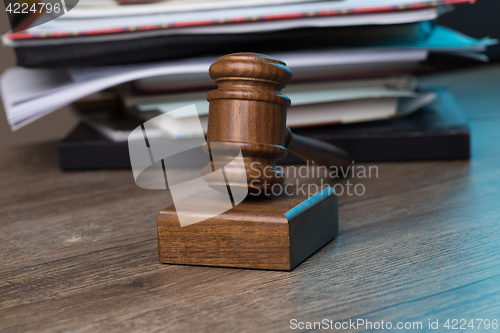 Image of Wooden table with hammer judge