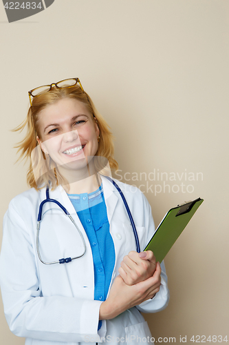 Image of Blonde doctor with green folder