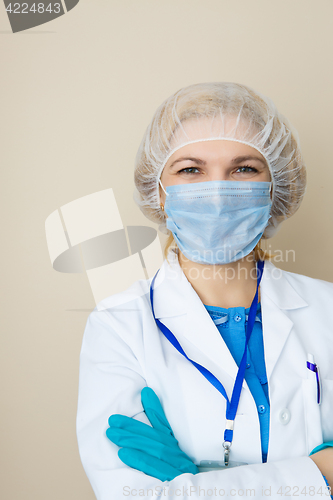 Image of Young doctor in mask, gloves