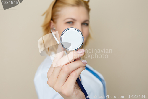 Image of Doctor with phonendoscope in hands