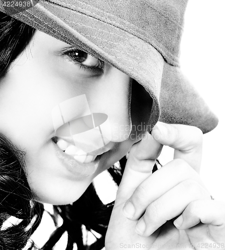 Image of Smiling And Cheeky Young Girl With A Hat