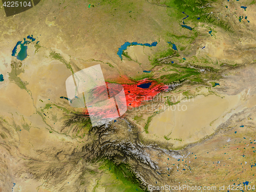 Image of Kyrgyzstan from space in red