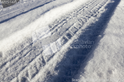 Image of traces of the car on snow