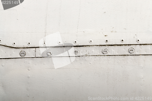 Image of metal surface with rivets