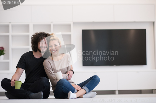 Image of young couple in their new home