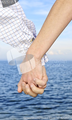 Image of Couple holding hands