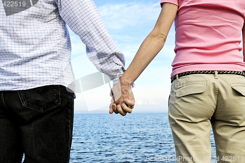 Image of Couple holding hands