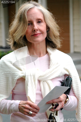Image of Mature female blond beauty.