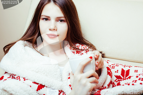 Image of young pretty brunette girl in Christmas ornament blanket getting warm on cold winter, freshness beauty concept, lifestyle people