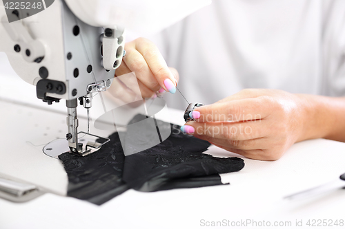 Image of Sewing on a machine. 