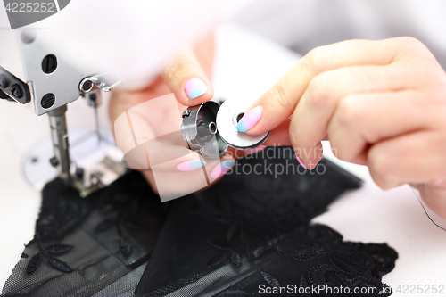 Image of Seamstress. Sewing. Factory, sewing room.