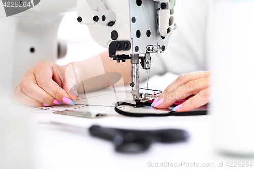 Image of Sewing on a machine.  Sewing machine  Sewing. Sewing machine 