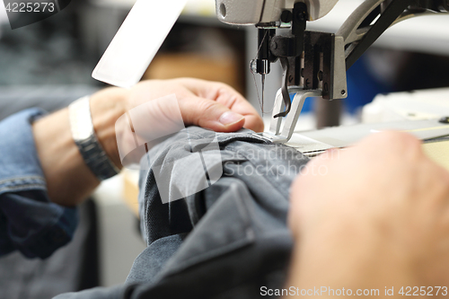 Image of Design clothes . Constructor. Sewing on a machine. 