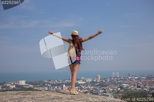 Image of Girl standing with hands up