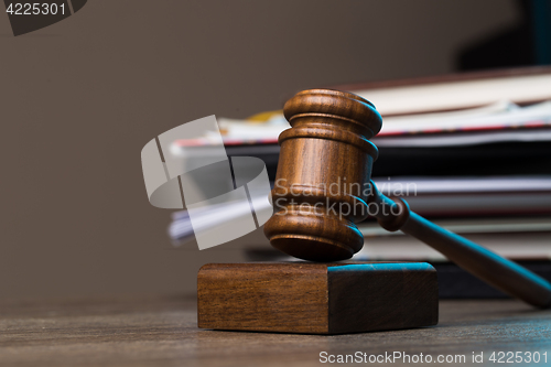 Image of Hammer, paper lies on table