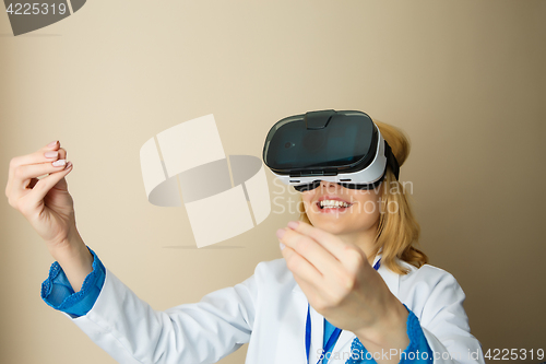 Image of Young doctor watching x-ray photograph