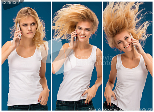 Image of Portrait of beautiful smiling girl with mobile phone