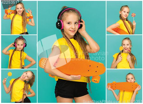 Image of Pretty skater girl holding skateboard