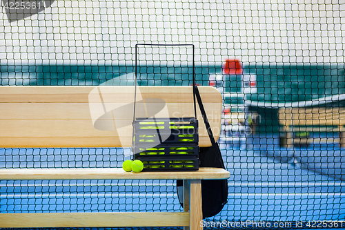 Image of Close up view of tennis court through the net