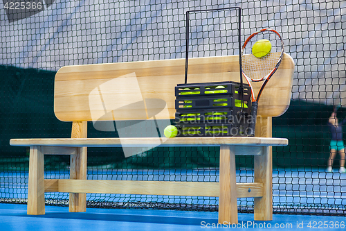 Image of Close up view of tennis court through the net