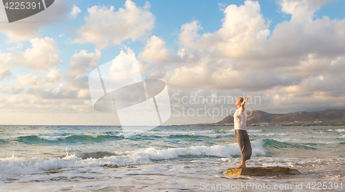 Image of Free Happy Woman Enjoying Sunset on Sandy Beach