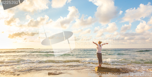 Image of Free Happy Woman Enjoying Sunset on Sandy Beach