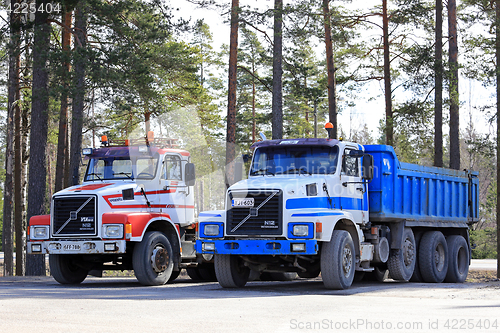 Image of Two Classic Conventional Volvo N12 Trucks