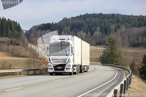 Image of White MAN TGX D38 Cargo Truck on Scenic Road